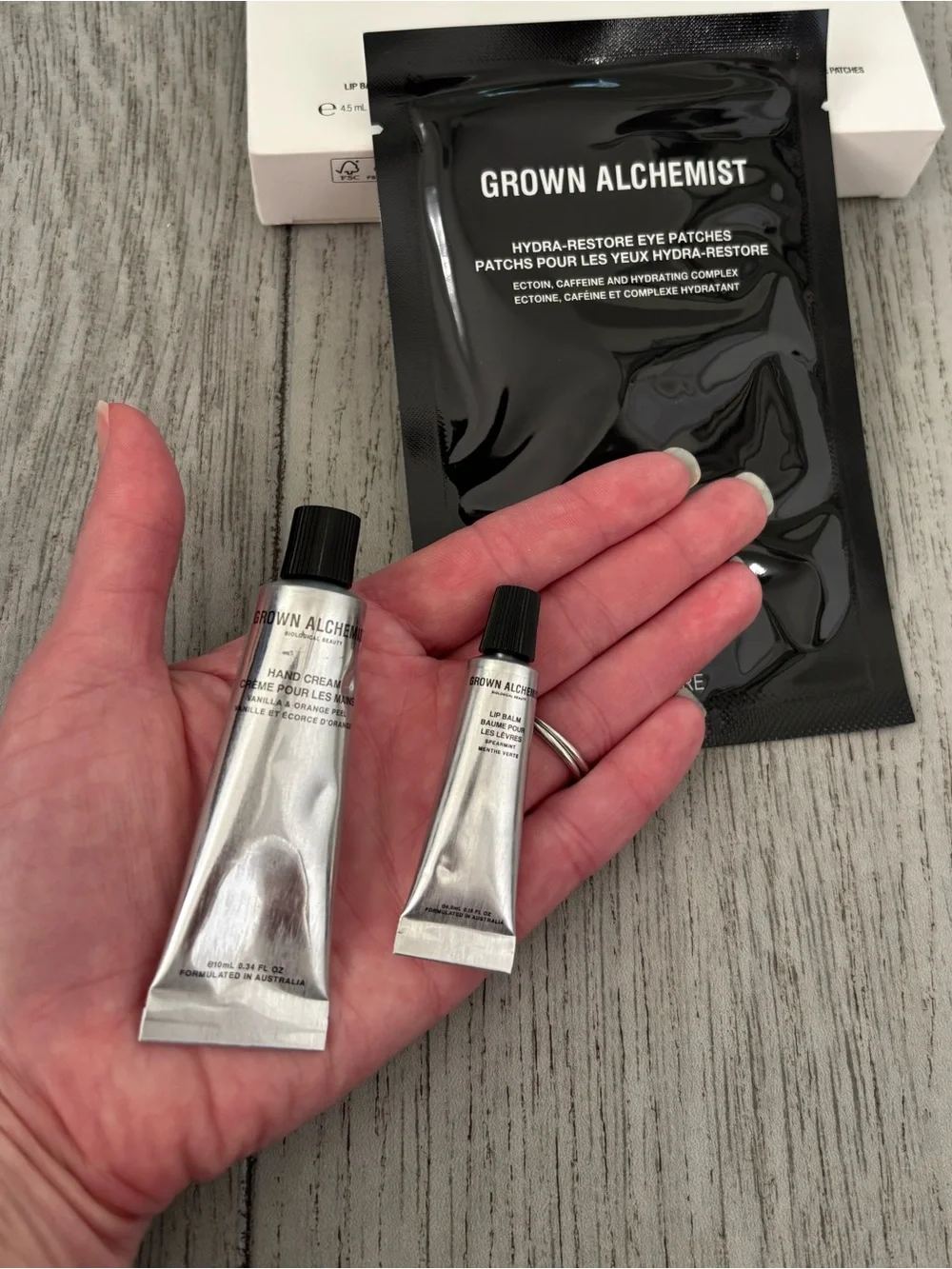 Grown Alchemist travel mini trio lip balm hand cream eye patches. New and sealed